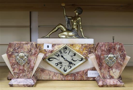 An Art Deco rose marble mantel clock garniture with bronze figure height 31cm